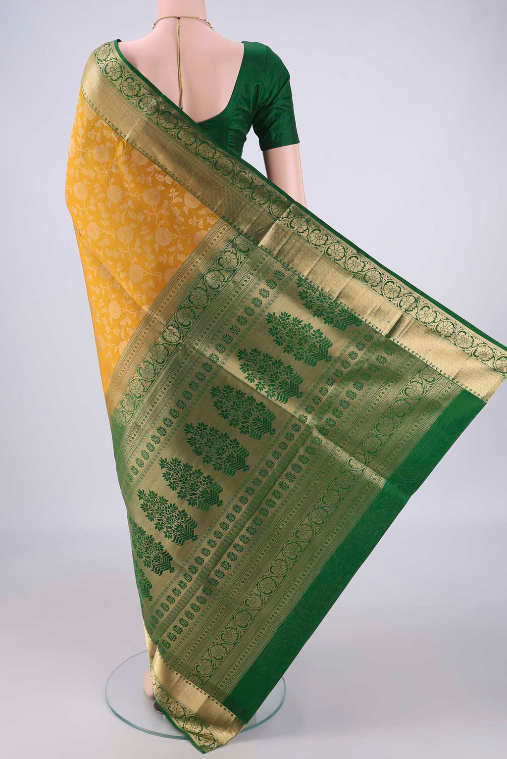 Flat view of Mustard Soft Silk Saree with Zari Brocade on the body and Zari Border. 