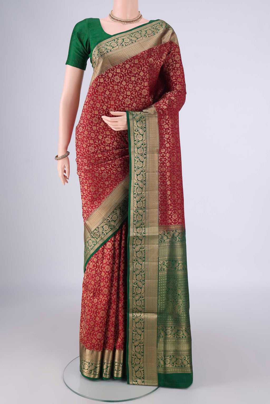 Maroon Soft Silk Saree with Zari Brocade on the body and Zari Border.  displayed on a mannequin