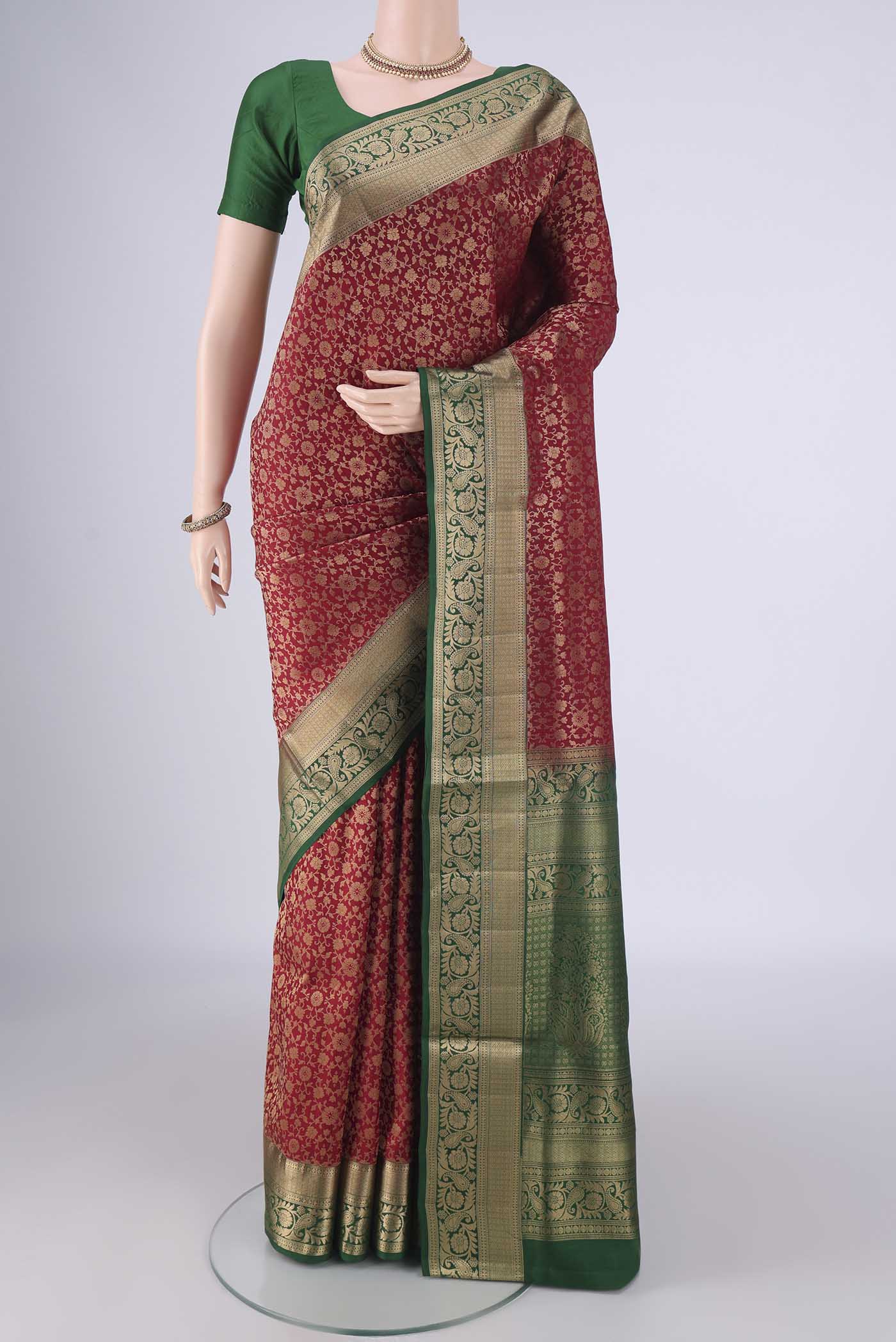 Maroon Soft Silk Saree with Zari Brocade on the body and Zari Border.  displayed on a mannequin