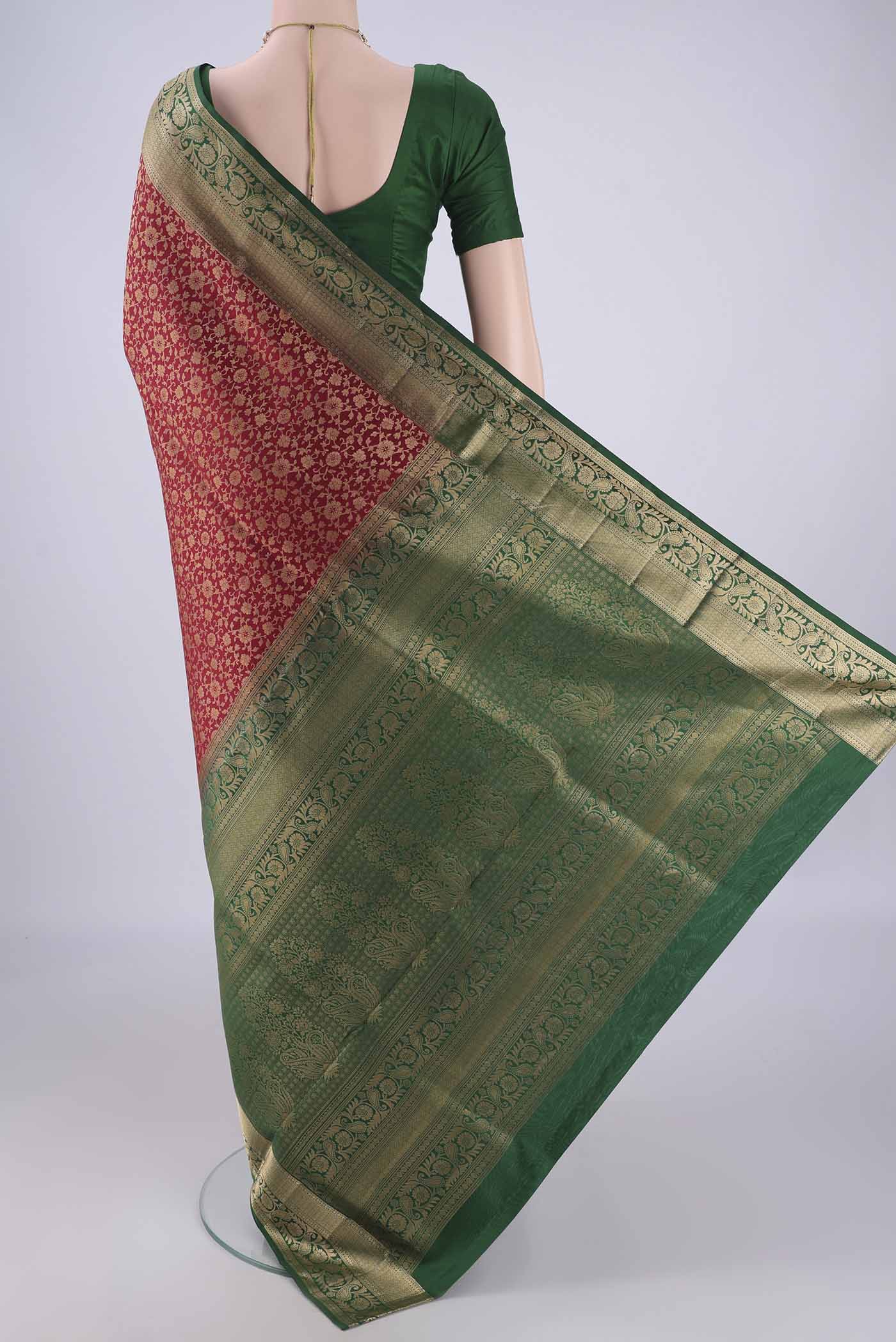 Flat view of Maroon Soft Silk Saree with Zari Brocade on the body and Zari Border. 