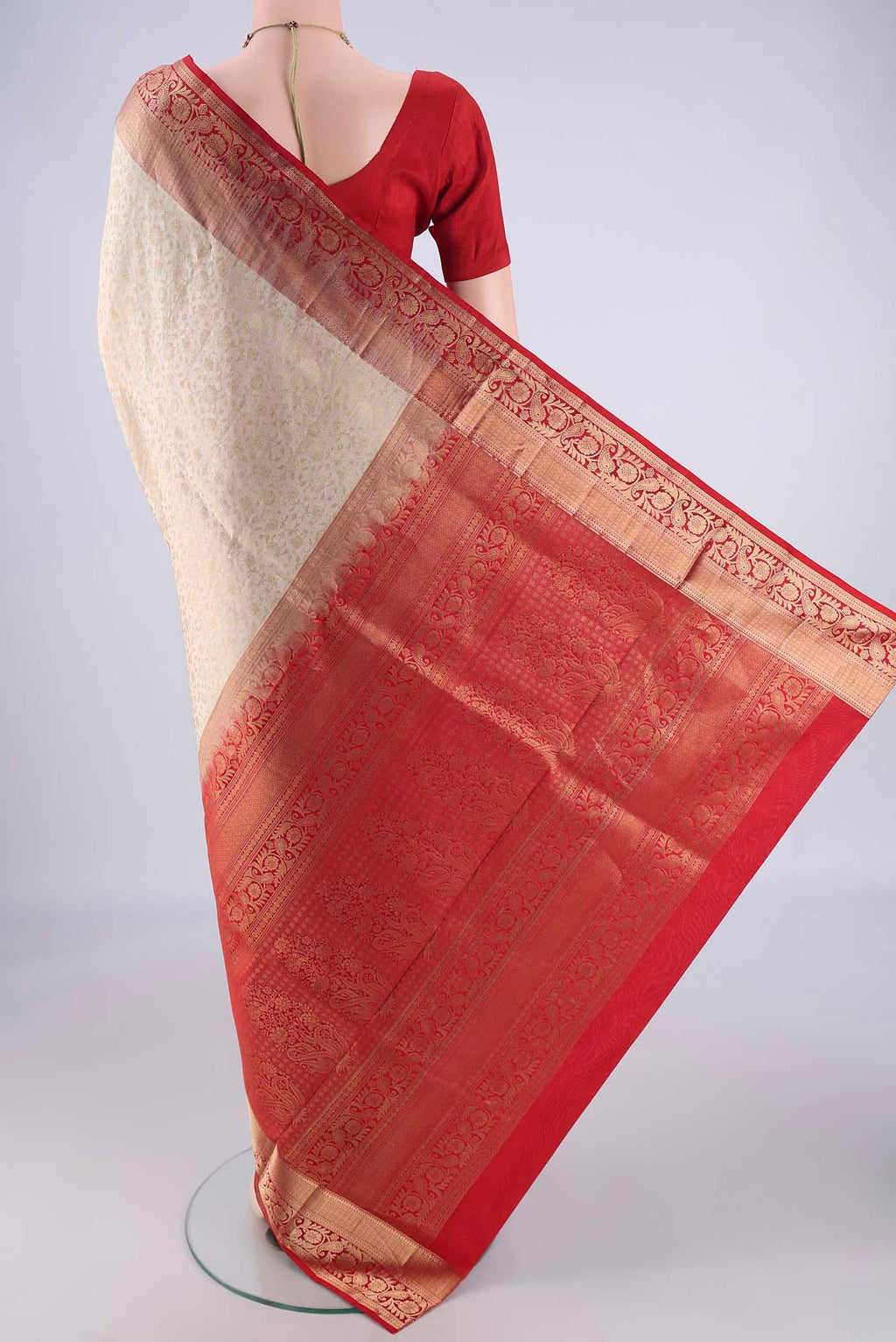 Flat view of Off White Soft Silk Saree with Zari Brocade on the body and Zari Border. 