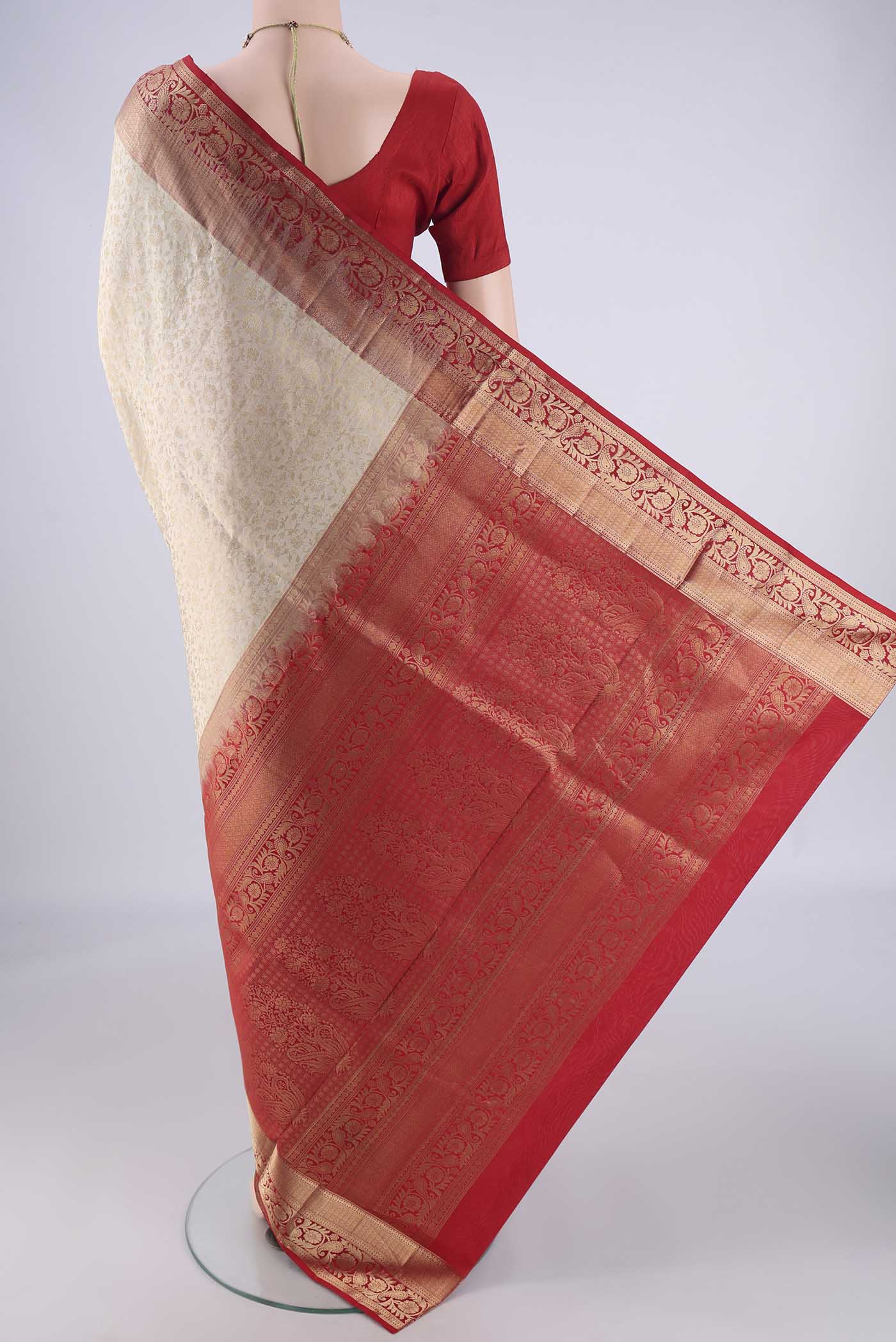 Flat view of Off White Soft Silk Saree with Zari Brocade on the body and Zari Border. 