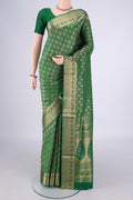 Green Soft Silk Saree with Zari Brocade on the body and Zari Border.  displayed on a mannequin