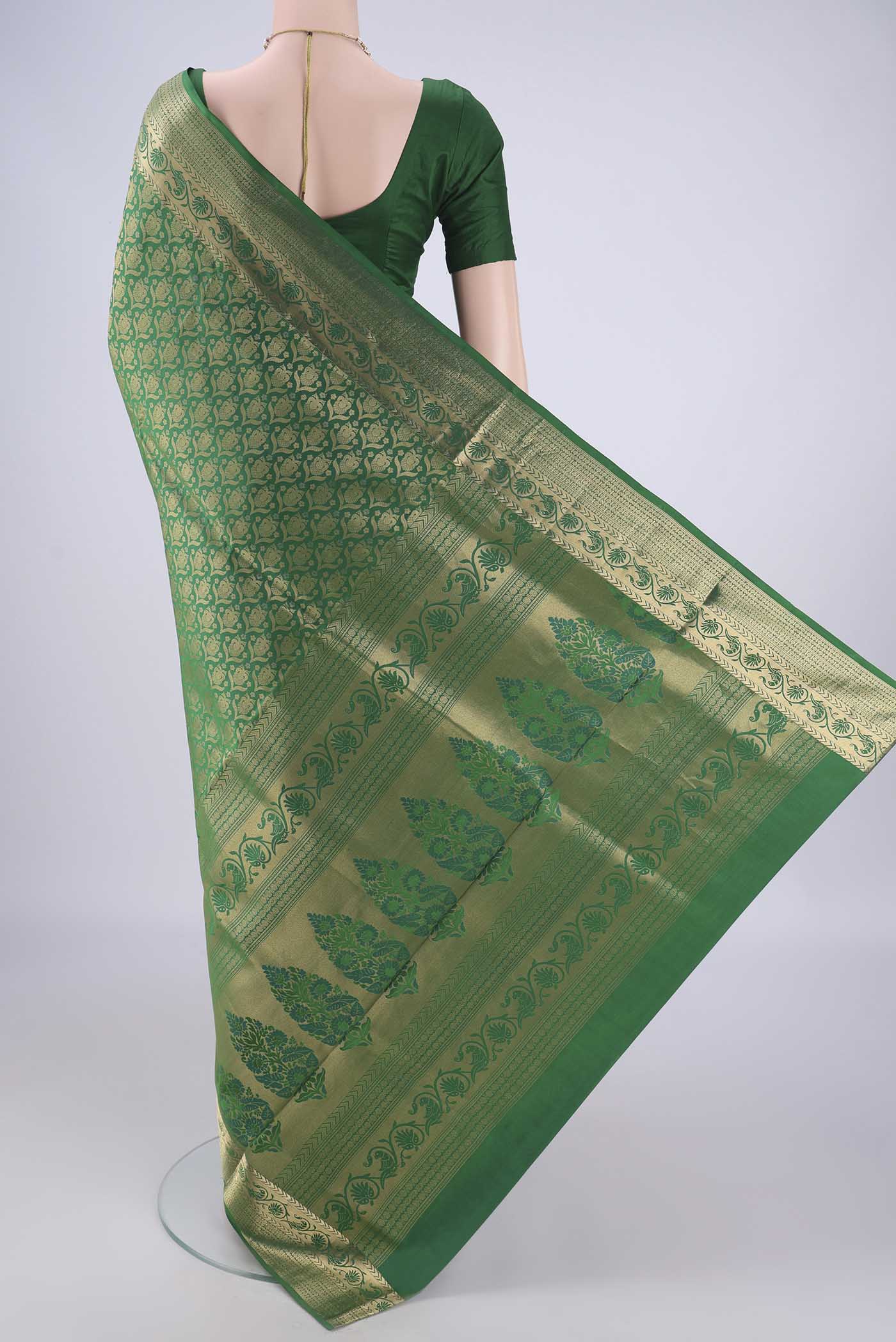 Flat view of Green Soft Silk Saree with Zari Brocade on the body and Zari Border. 