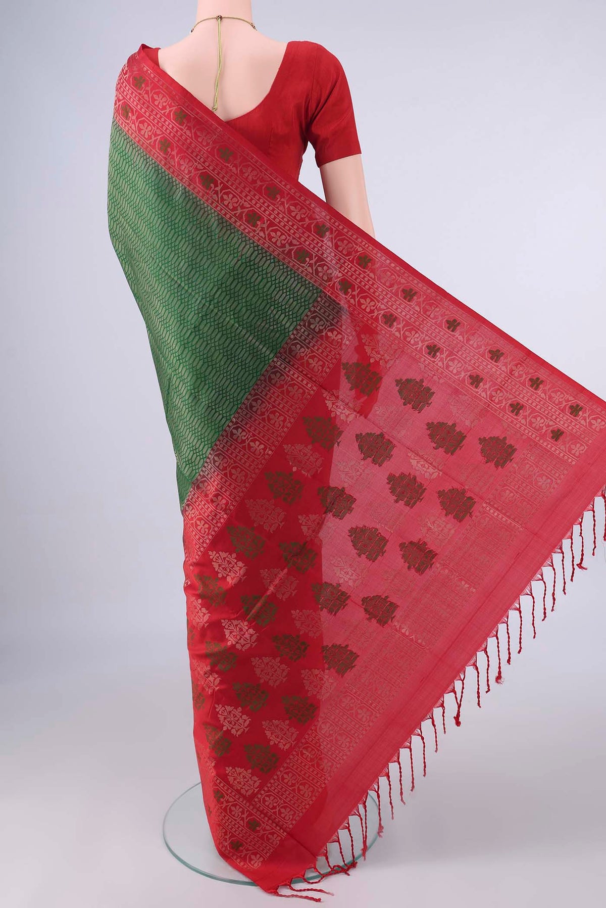 Flat view of Pure Silk Bottle Green Soft Saree with Zari Brocade on the body and Zari And Thread Border. 