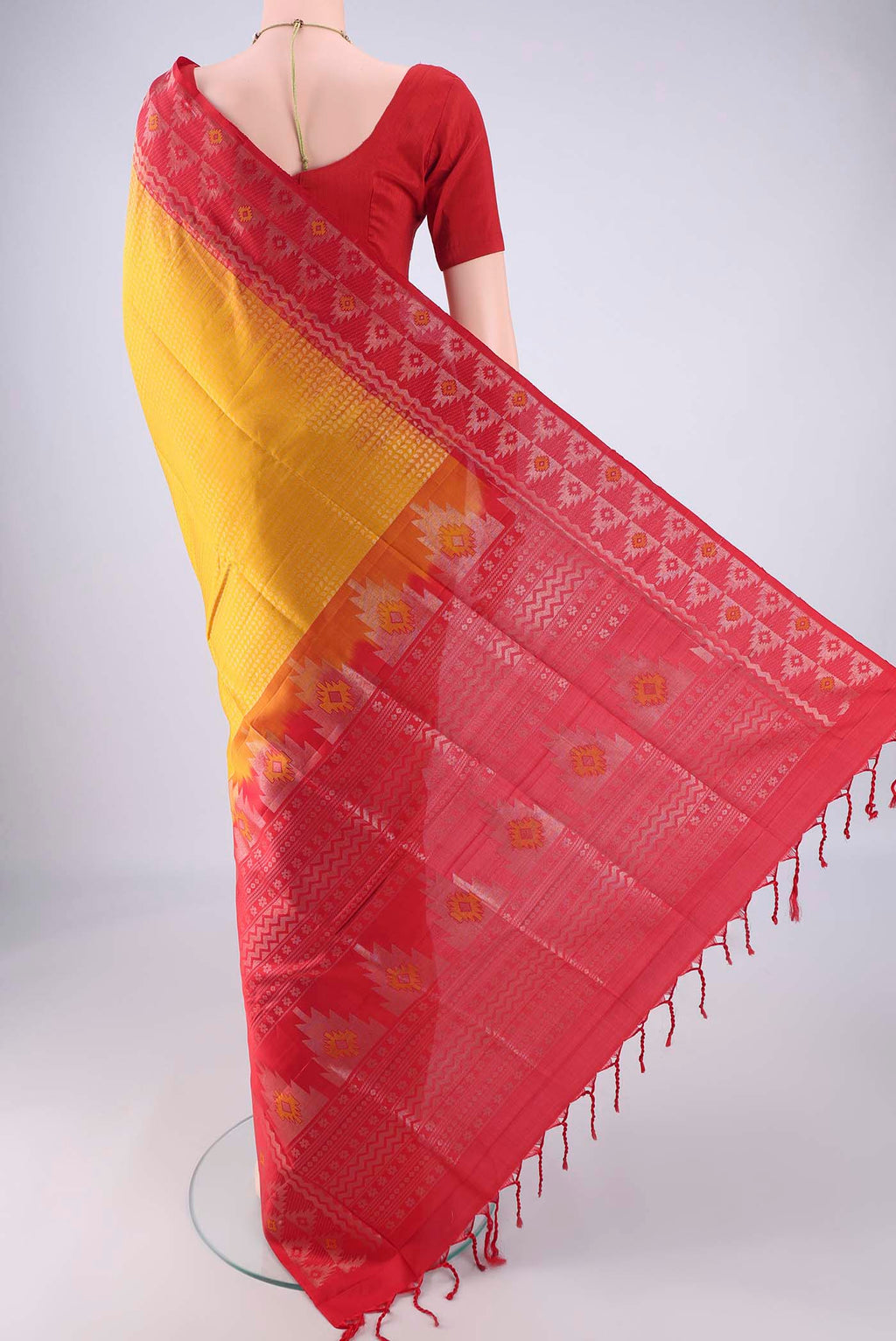 Flat view of Mustard Soft Silk Saree with Zari Brocade on the body and Zari And Thread Border. 