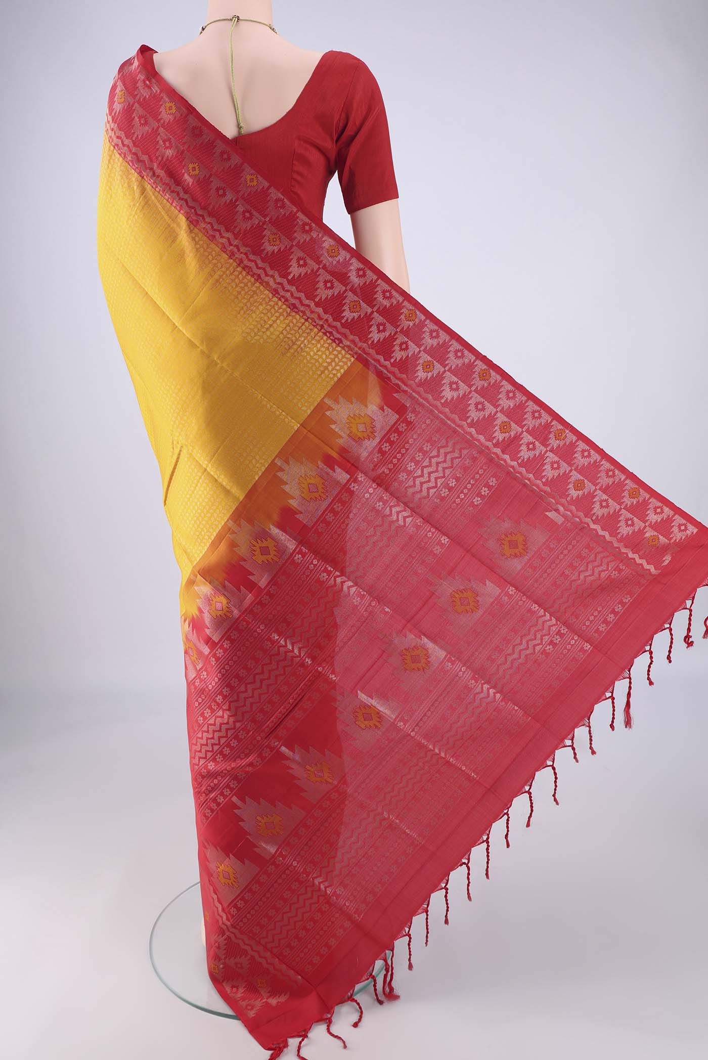 Flat view of Mustard Soft Silk Saree with Zari Brocade on the body and Zari And Thread Border. 