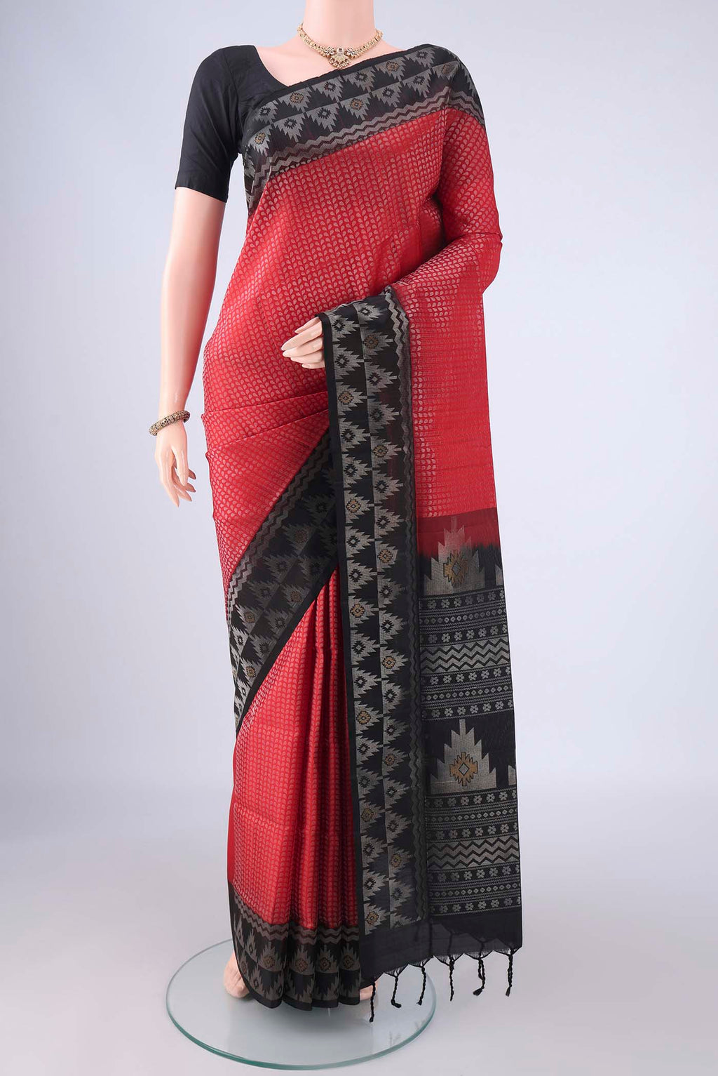 Red Soft Silk Saree with Zari Brocade on the body and Zari Border.  displayed on a mannequin