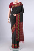Pure Silk Black Soft Saree with Zari Brocade on the body and Zari Border.  displayed on a mannequin