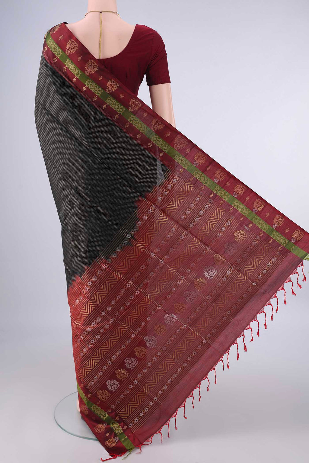 Flat view of Pure Silk Black Soft Saree with Zari Brocade on the body and Zari Border. 