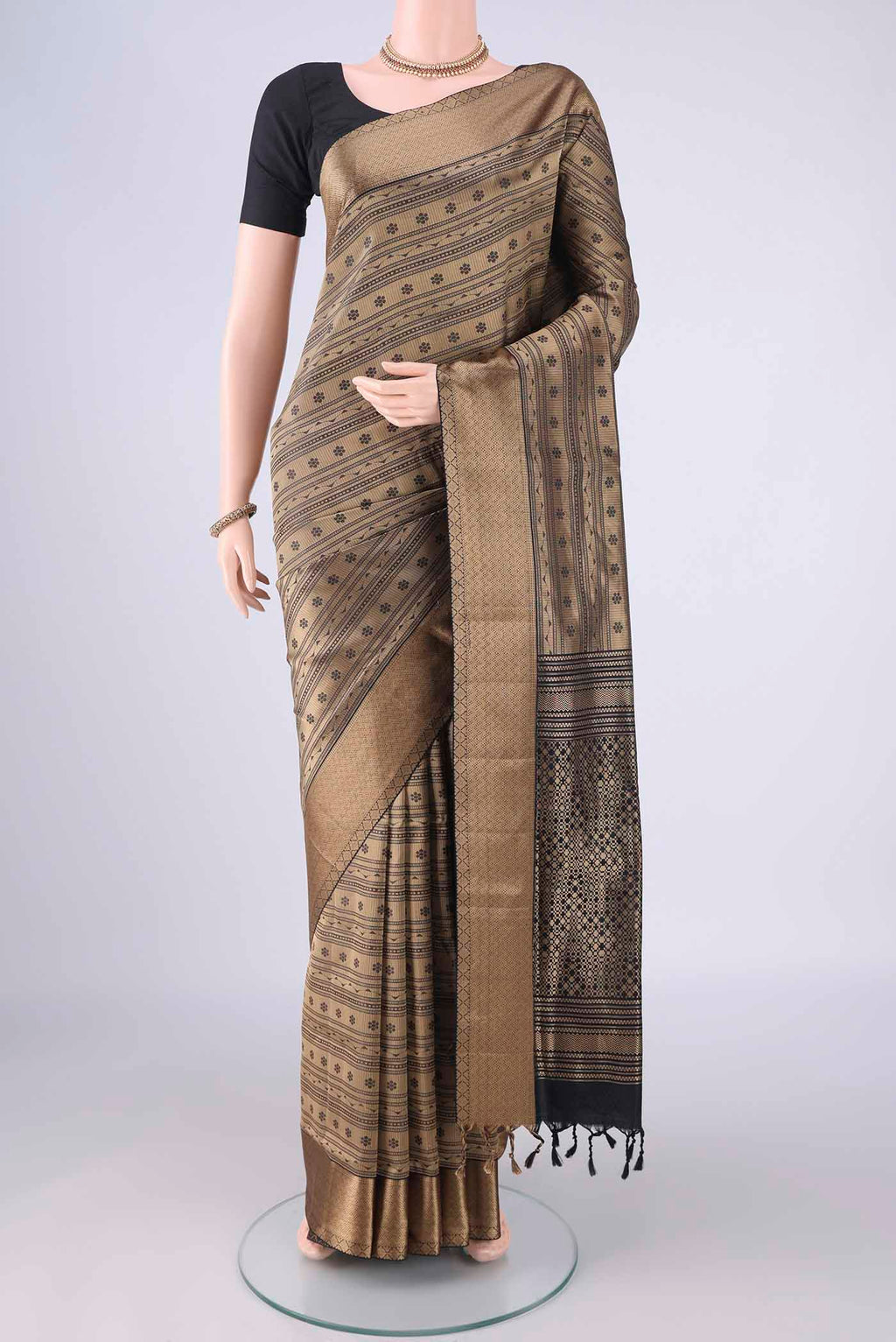 Black Soft Silk Saree with Jacquard design on the body and Thread Border.  displayed on a mannequin