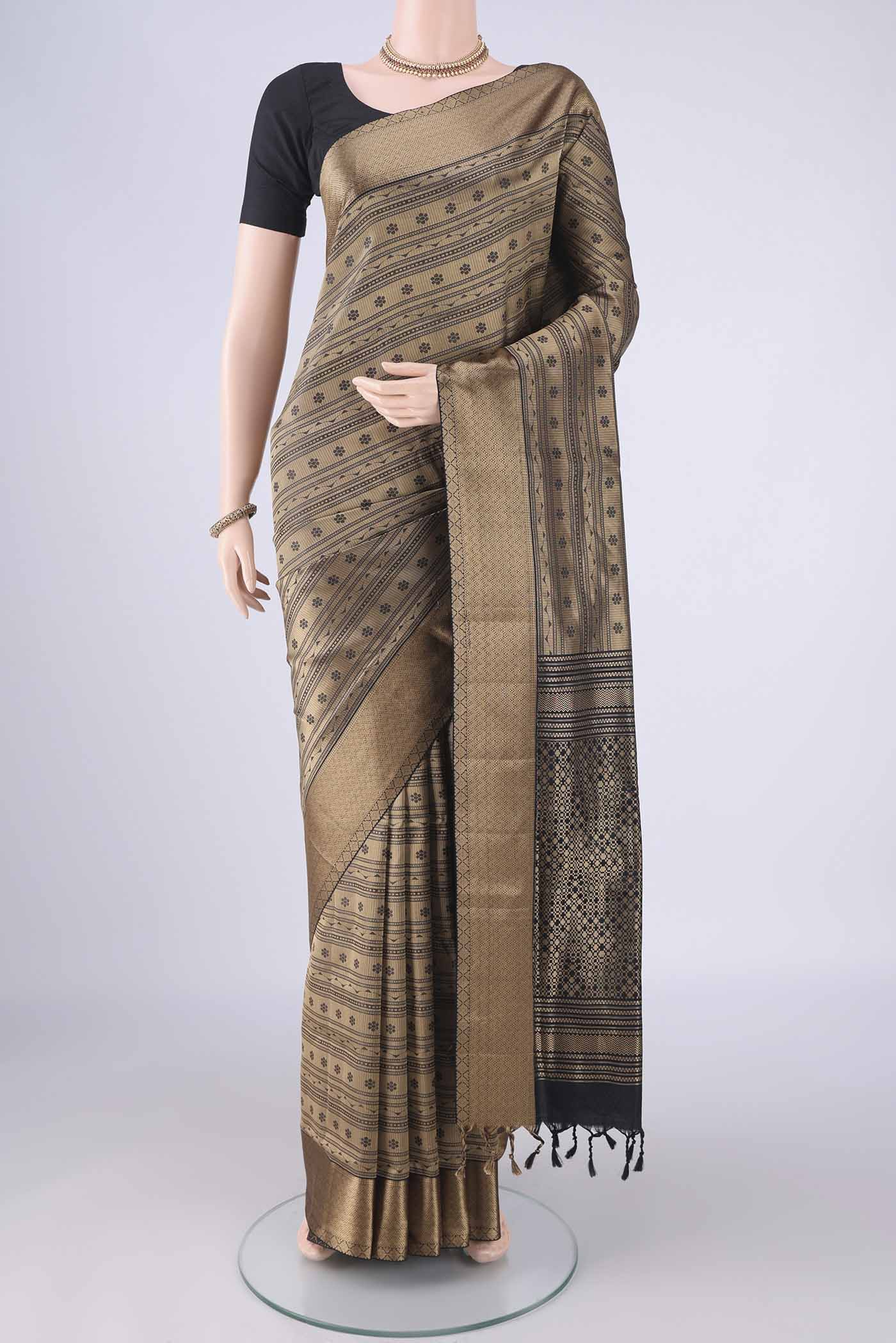 Black Soft Silk Saree with Jacquard design on the body and Thread Border.  displayed on a mannequin