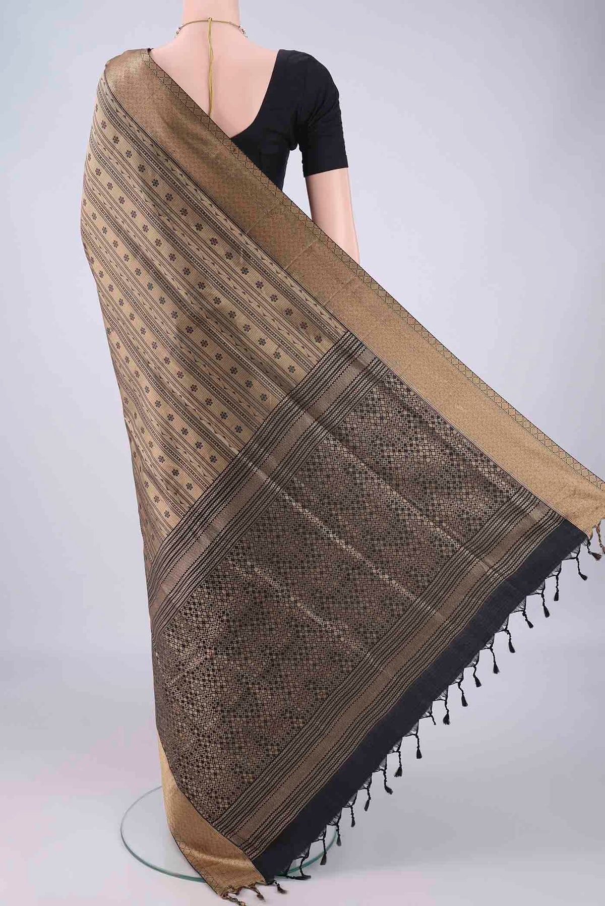 Flat view of Black Soft Silk Saree with Jacquard design on the body and Thread Border. 