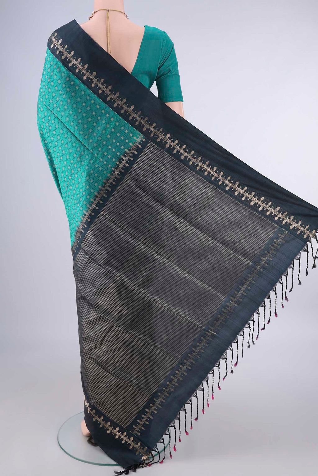 Flat view of Pure Silk Sea Green Soft Saree with Jacquard With Zari Butta on the body and Zari And Thread Border. 