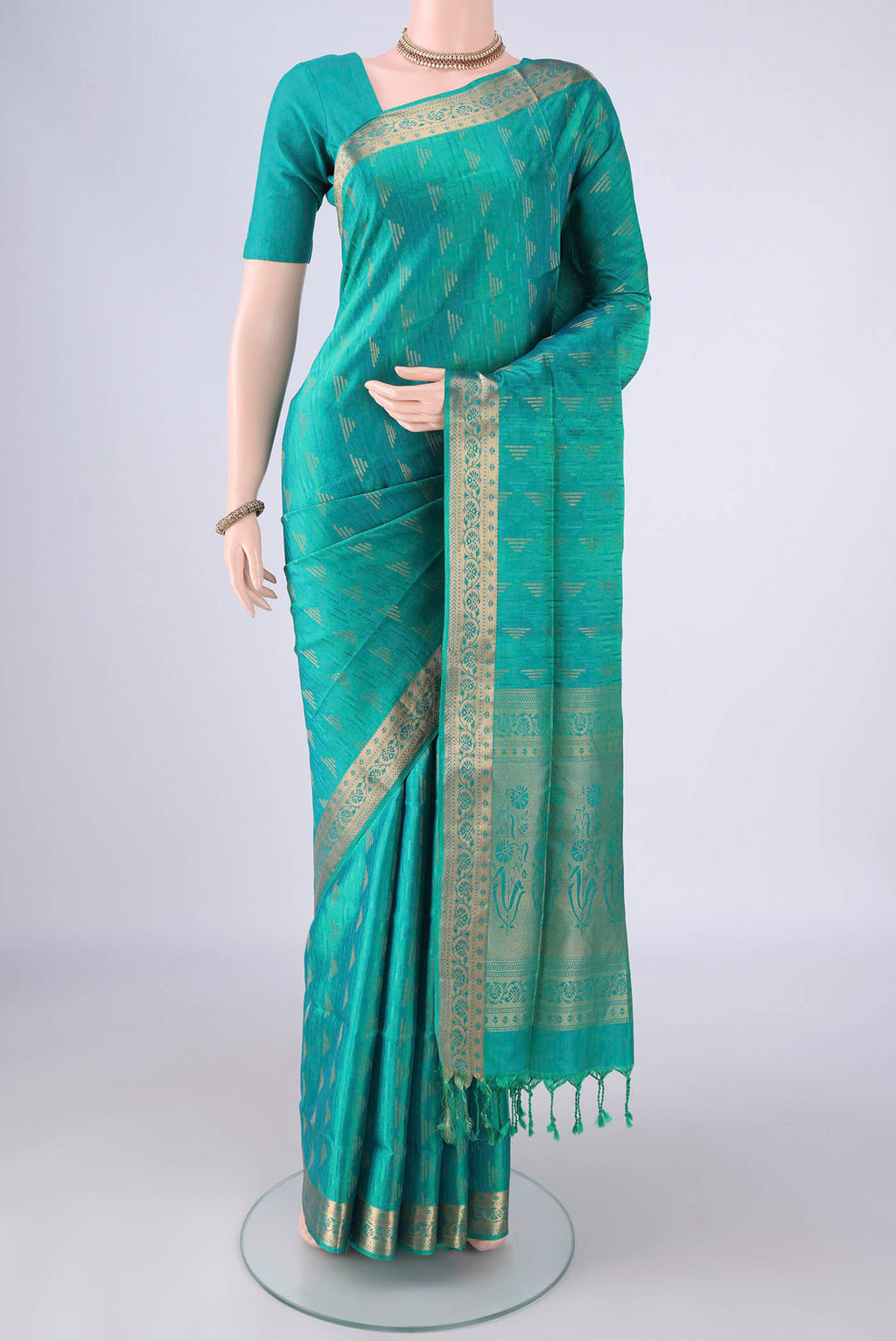 Sea Green Soft Silk Saree with Jacquard With Zari Butta on the body and Thread Border.  displayed on a mannequin
