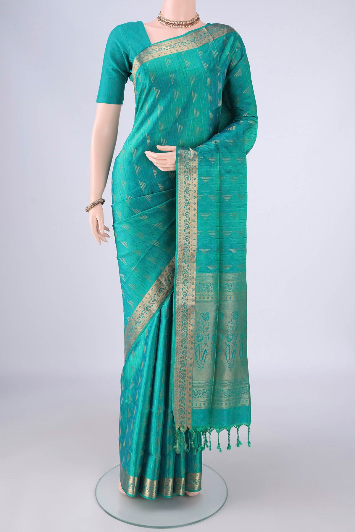 Sea Green Soft Silk Saree with Jacquard With Zari Butta on the body and Thread Border.  displayed on a mannequin