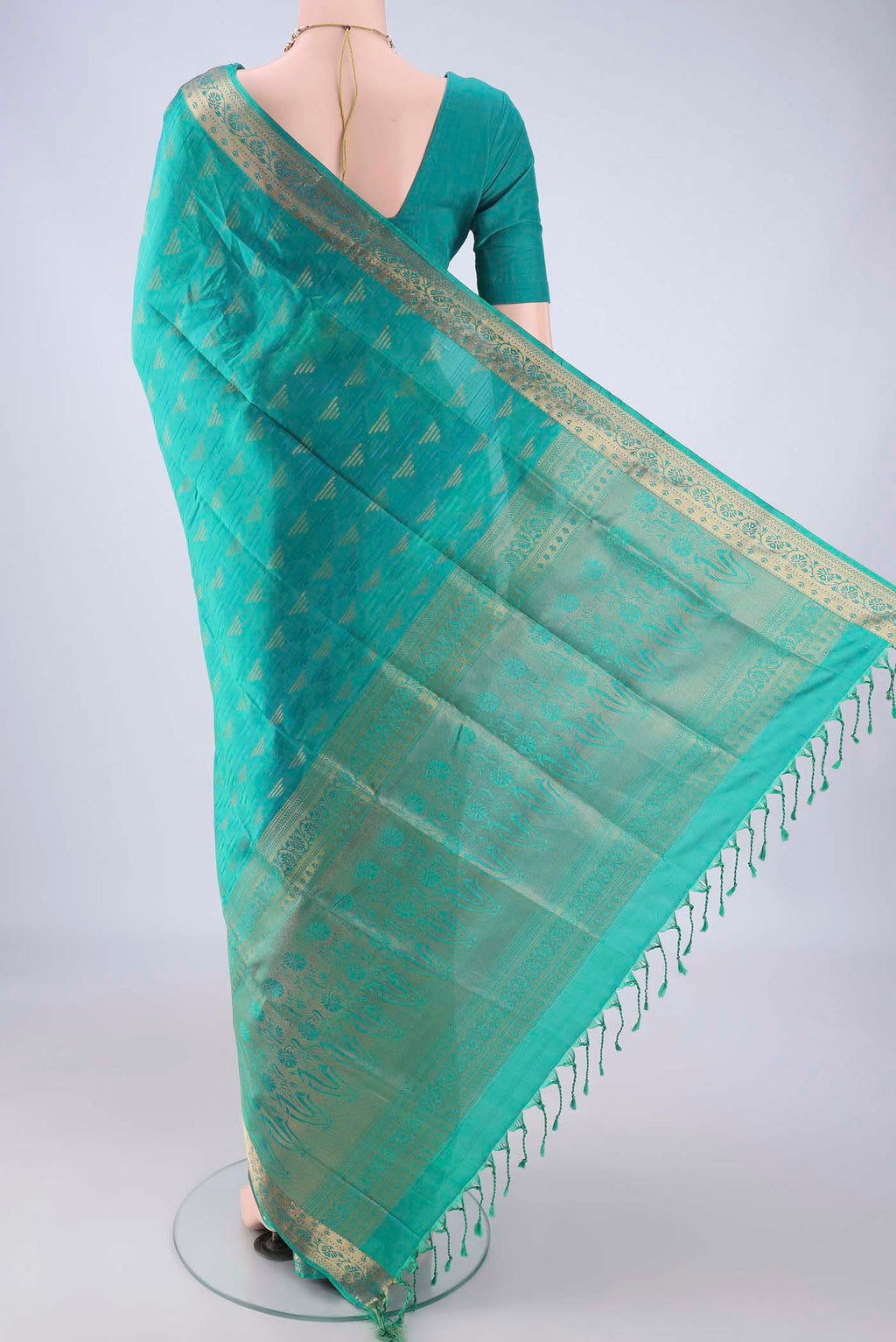 Flat view of Sea Green Soft Silk Saree with Jacquard With Zari Butta on the body and Thread Border. 