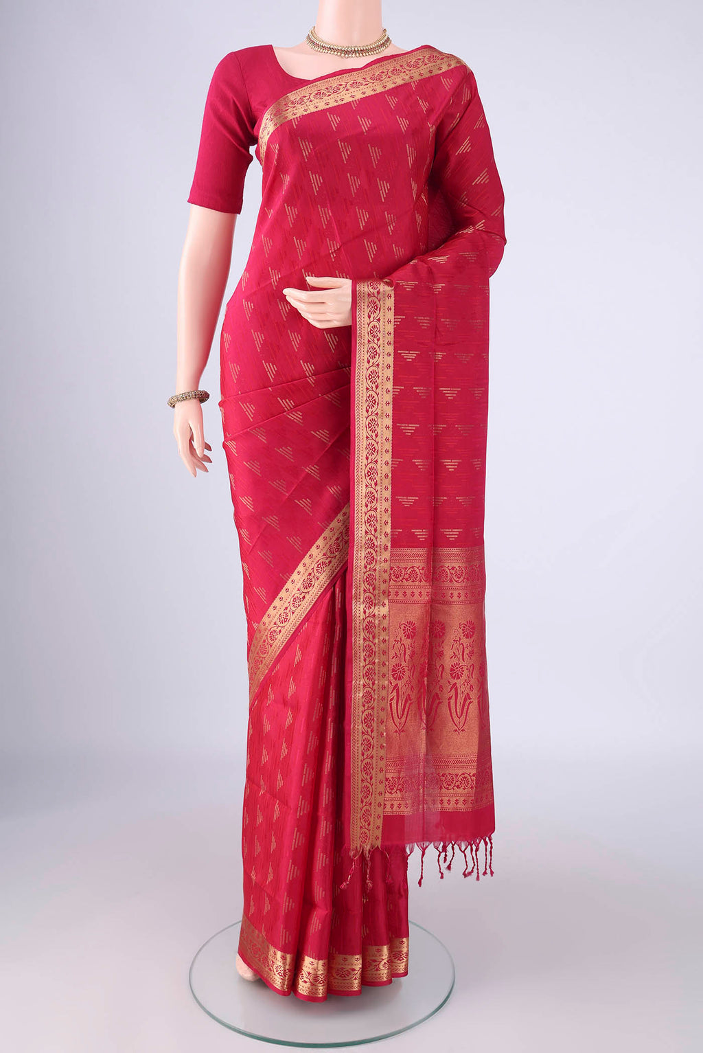 Rani Pink Soft Silk Saree with Jacquard With Zari Butta on the body and Zari Border.  displayed on a mannequin