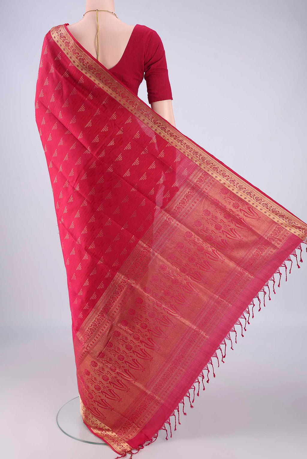 Flat view of Rani Pink Soft Silk Saree with Jacquard With Zari Butta on the body and Zari Border. 