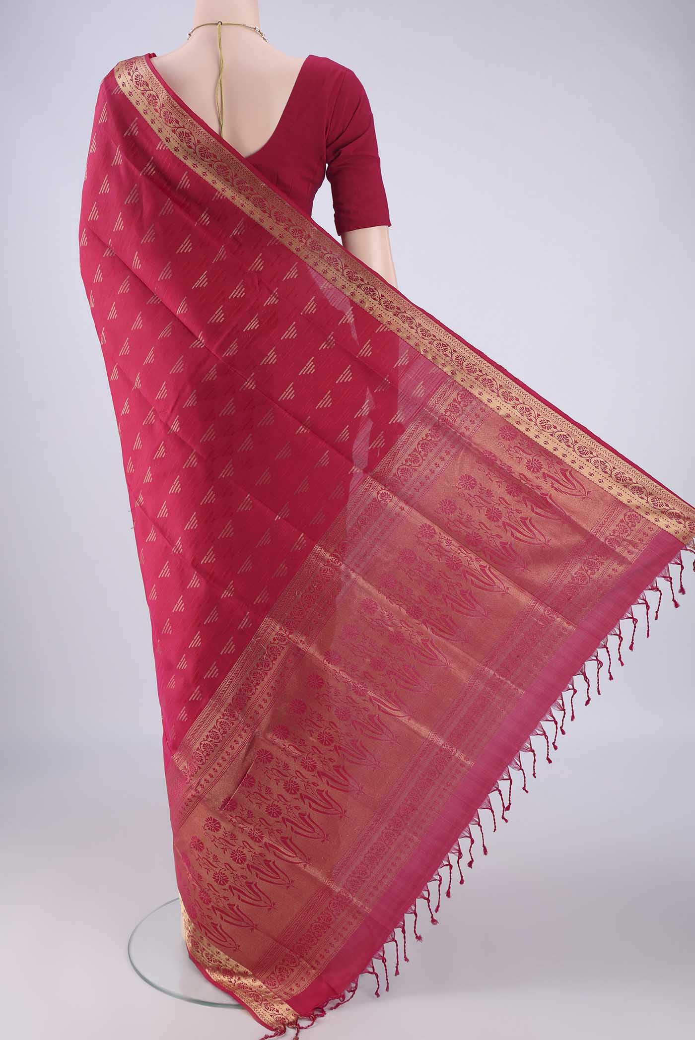 Flat view of Rani Pink Soft Silk Saree with Jacquard With Zari Butta on the body and Zari Border. 