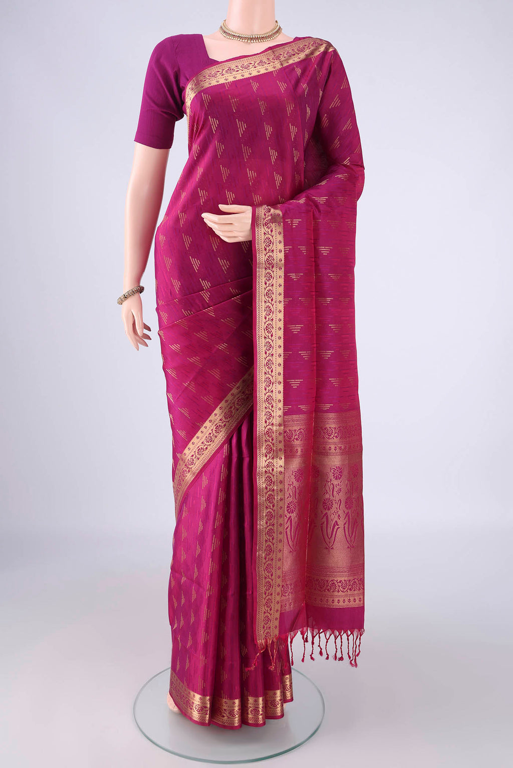 Magenta Soft Silk Saree with Jacquard With Zari Butta on the body and Zari Border.  displayed on a mannequin