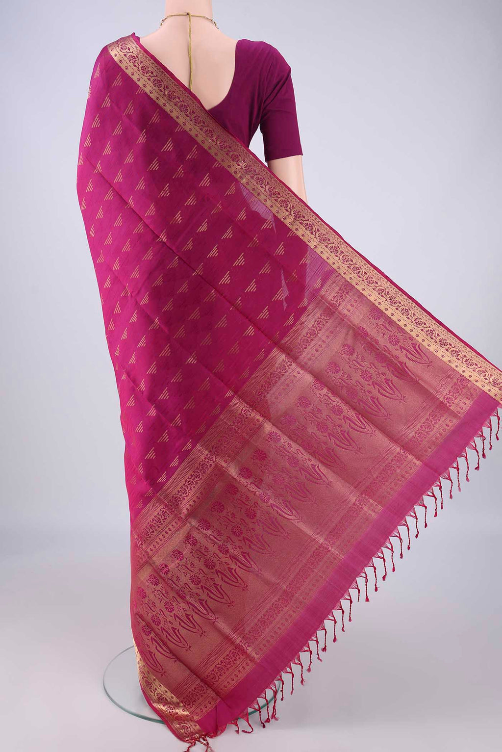 Flat view of Magenta Soft Silk Saree with Jacquard With Zari Butta on the body and Zari Border. 