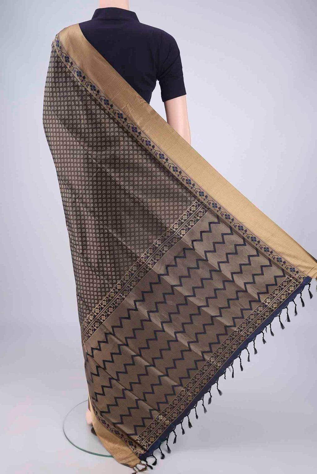 Flat view of Black Soft Silk Saree with Jacquard design on the body and Thread Border. 