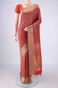 Rust Soft Silk Saree with Jacquard With Thread Butta on the body and Thread Border.  displayed on a mannequin