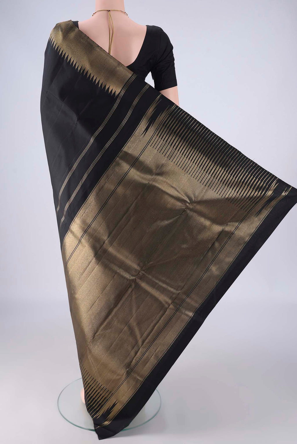 Flat view of Pure Silk Pure Zari Black Kanchipuram Saree with Plain Body and Temple Border. 