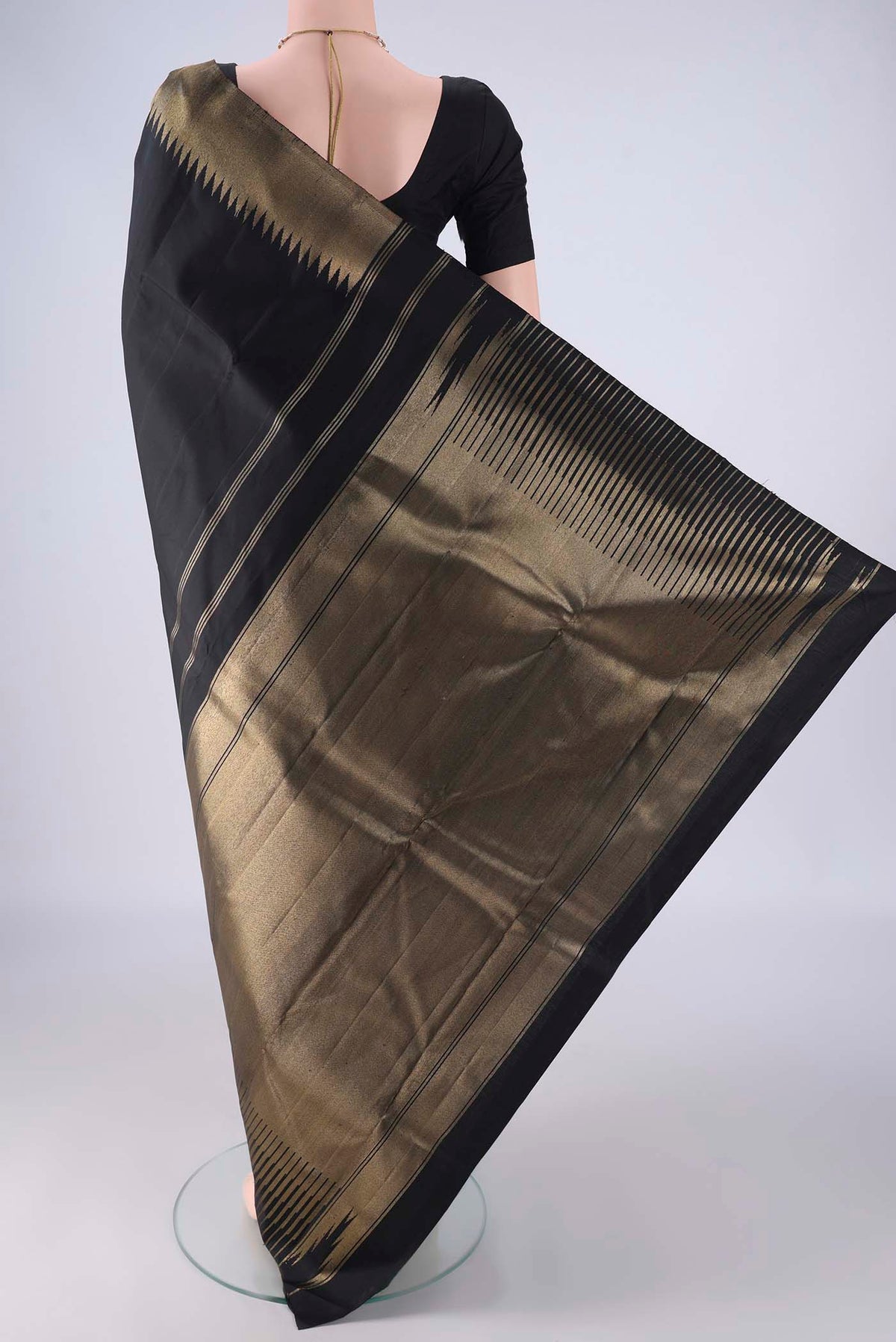 Flat view of Pure Silk Pure Zari Black Kanchipuram Saree with Plain Body and Temple Border. 