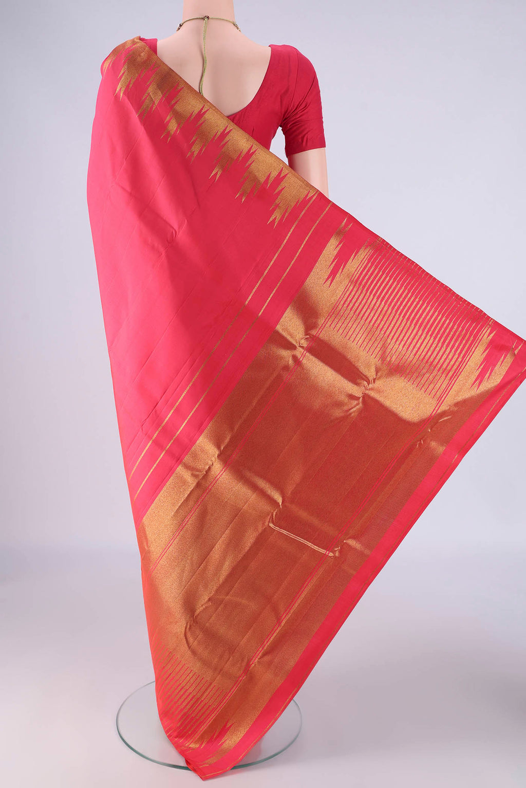 Flat view of Pure Silk Pure Zari Dark Pink Kanchipuram Saree with Plain Body and Temple Border. 