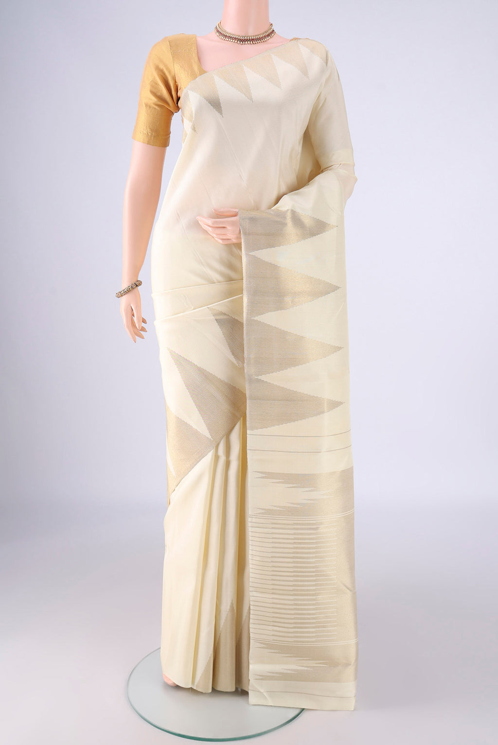 Pure Silk Pure Zari Off White Kanchipuram Saree with Plain Body and Temple Border.  displayed on a mannequin
