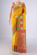 Lemon Yellow Kanjivaram Silk Saree with Plain Body and Temple Border.  displayed on a mannequin