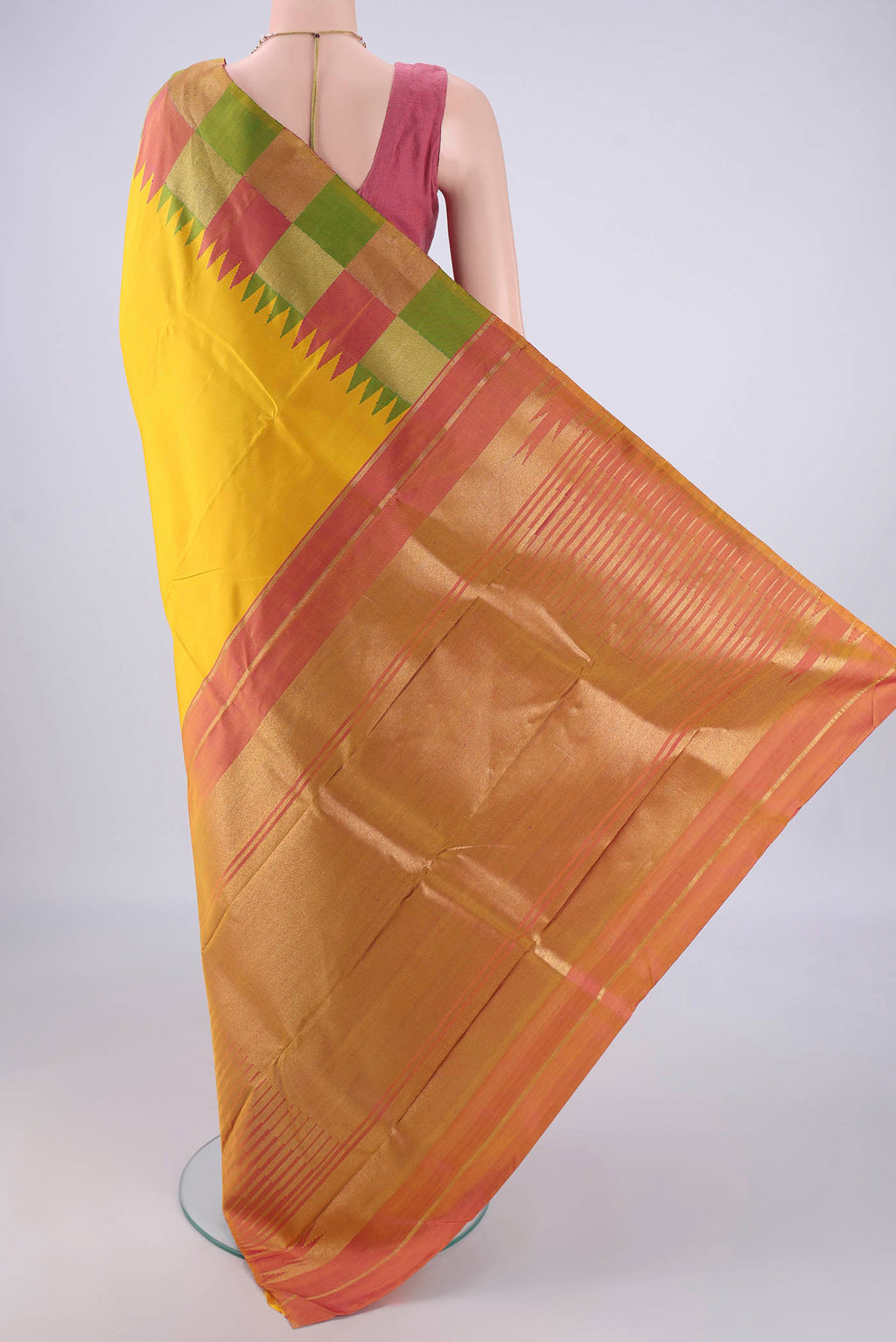 Flat view of Lemon Yellow Kanjivaram Silk Saree with Plain Body and Temple Border. 