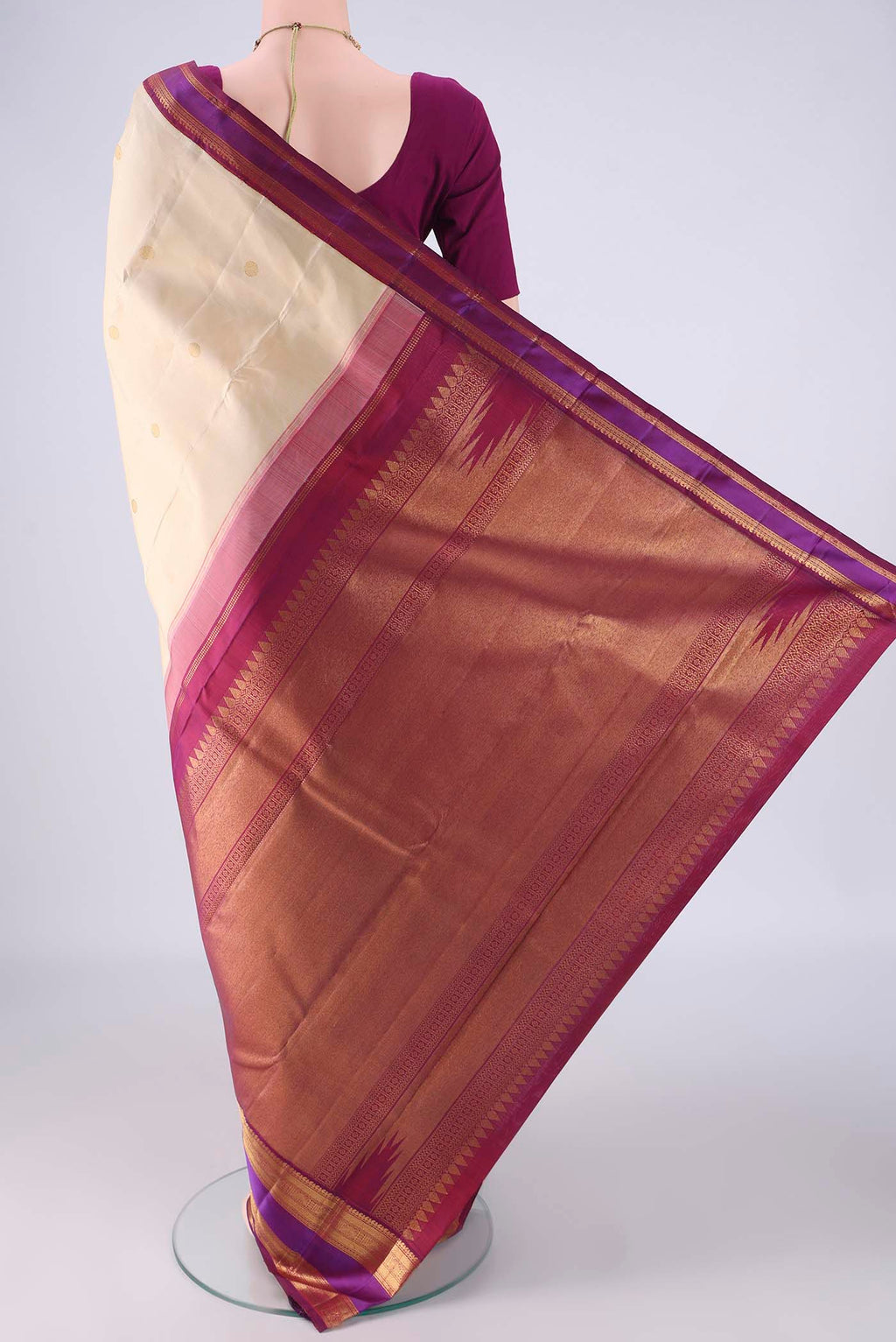 Flat view of Cream Kanjivaram Silk Saree with Zari Butta on the body and Zari Border. 