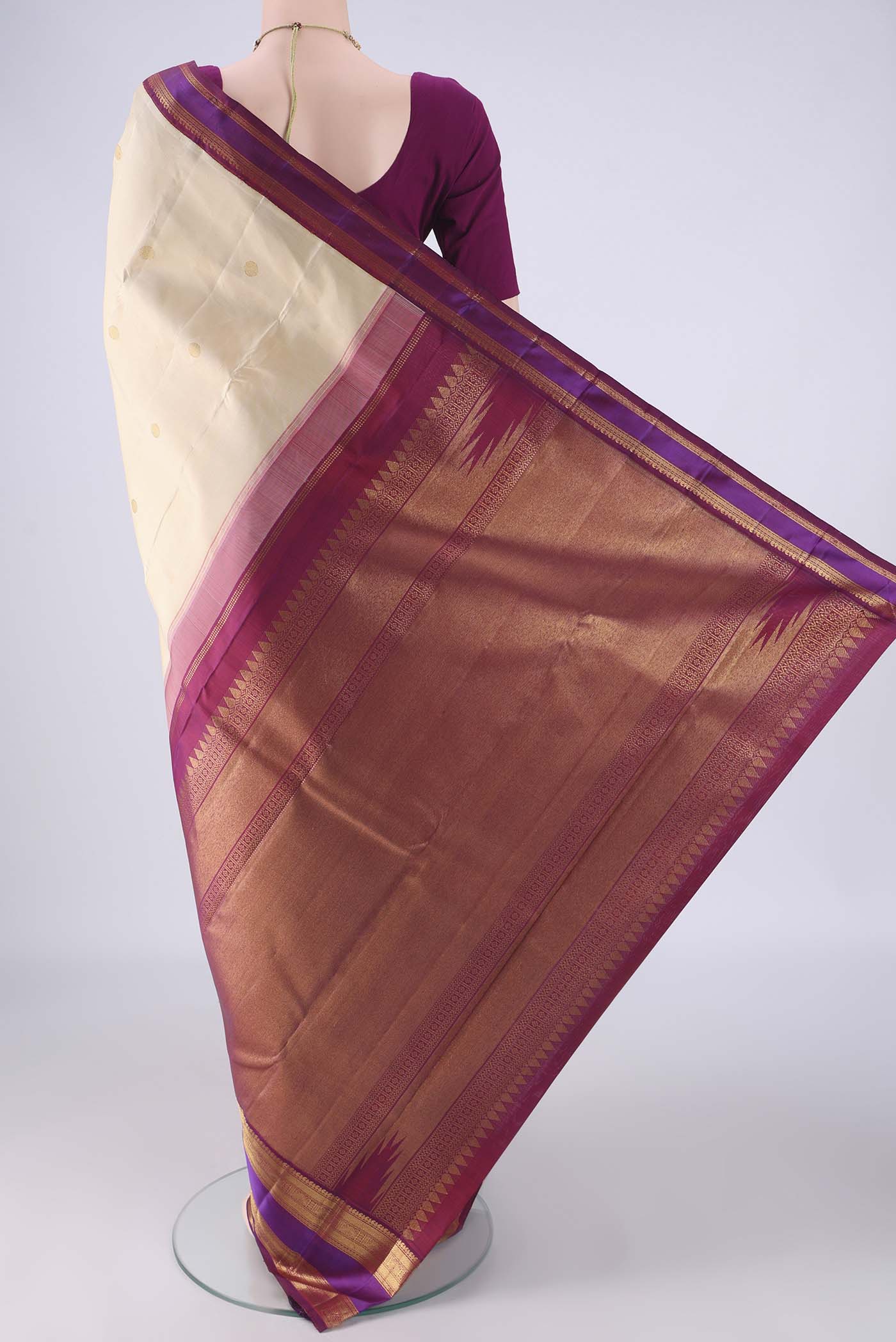 Flat view of Cream Kanjivaram Silk Saree with Zari Butta on the body and Zari Border. 