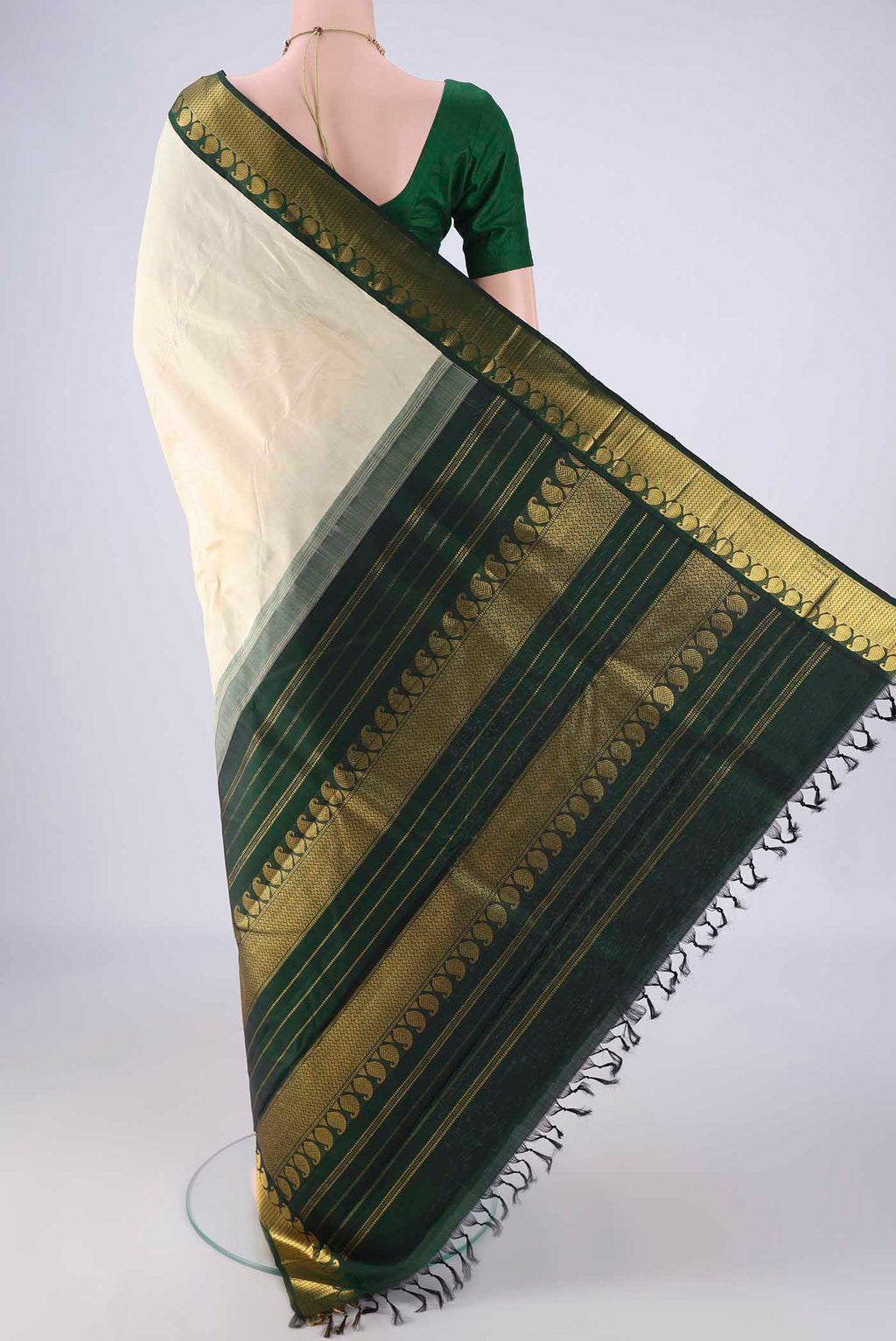 Flat view of Off White Kanjivaram Silk Saree with Plain Body and Zari Border. 