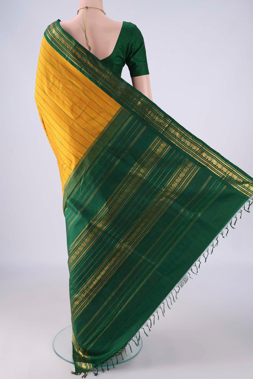 Flat view of Mustard Kanchipuram Silk Saree with Veldhari on the body and Zari Border. 