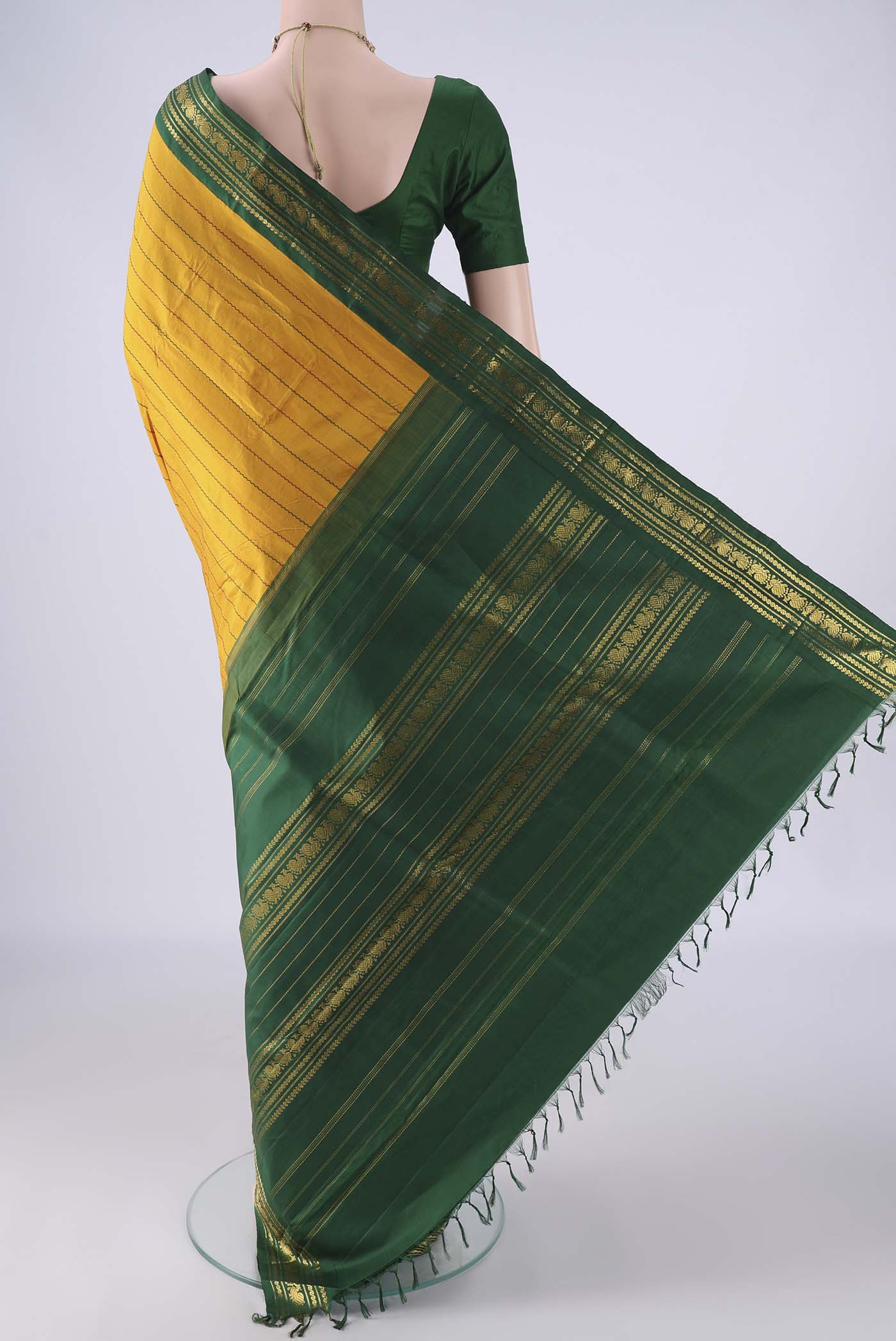 Flat view of Mustard Kanchipuram Silk Saree with Veldhari on the body and Zari Border. 
