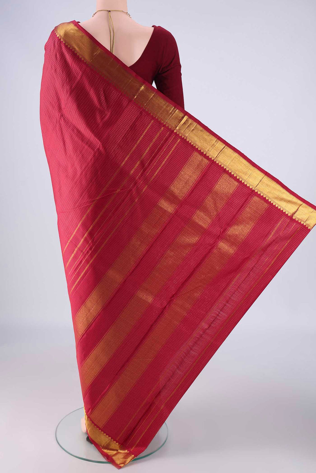 Flat view of Deep Red Kanchipuram Silk Saree with Checked design on the body and Zari Border. 