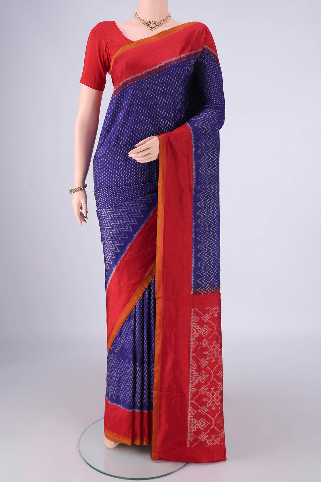 Dark Blue Pochampally Silk Saree with Pure Ikat on the body and Plain Border.  displayed on a mannequin