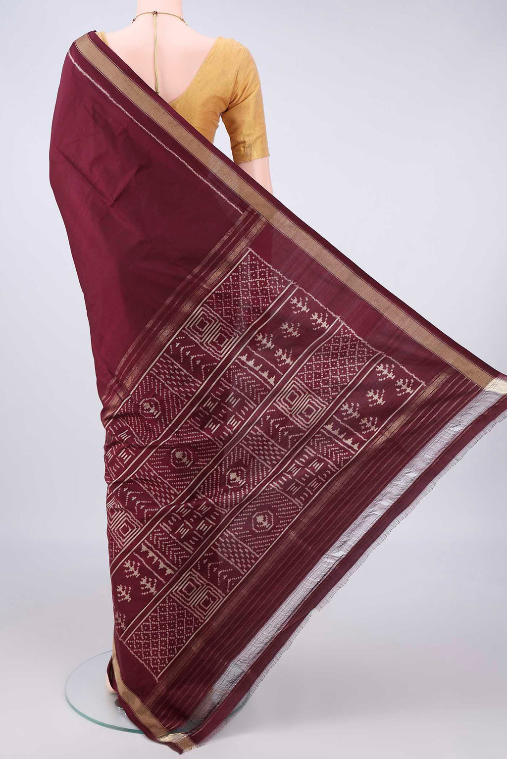 Flat view of Pure Silk Brown Pochampally Saree with Pure Ikat on the body and Zari Border. 