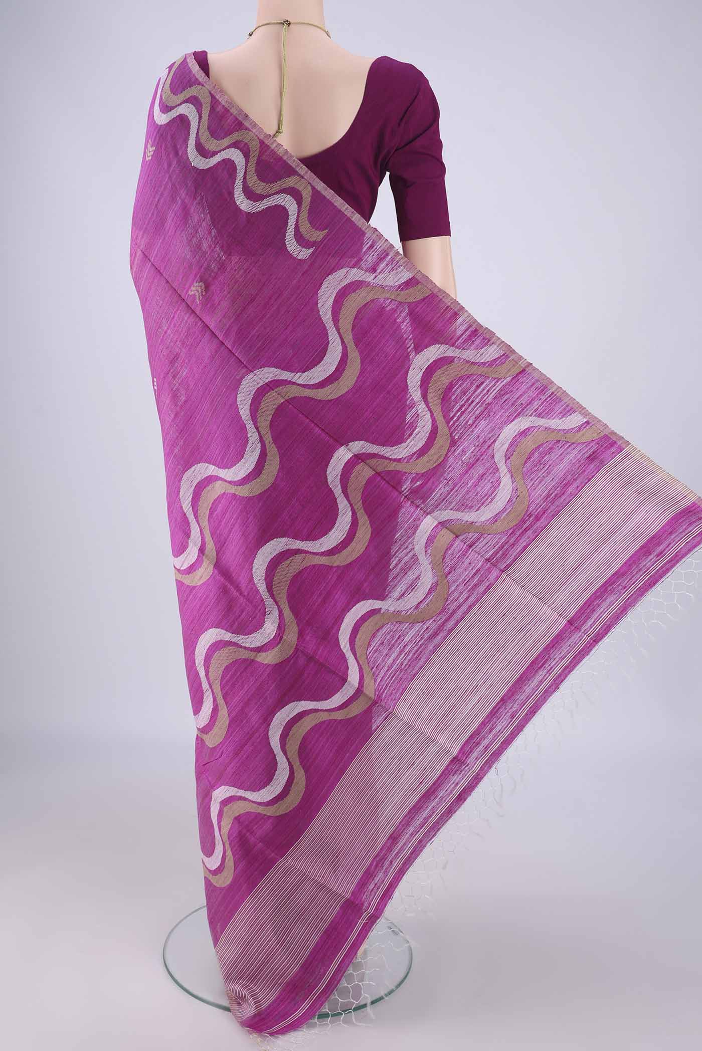 Flat view of Magenta Tussar Silk Saree with Plain Body and Fancy Border. 