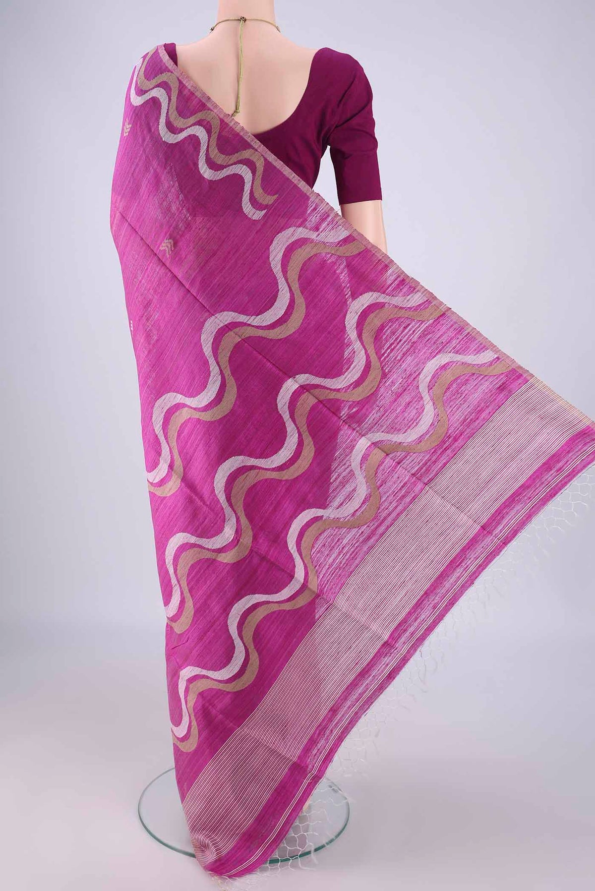 Flat view of Magenta Tussar Silk Saree with Plain Body and Fancy Border. 