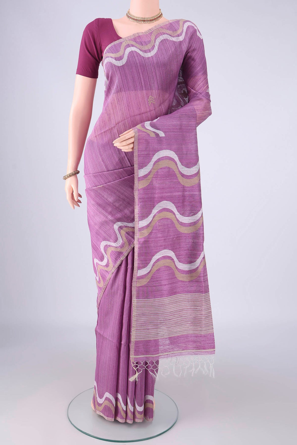 Lavender Jute Silk Saree with Plain Body and Thread Border.  displayed on a mannequin