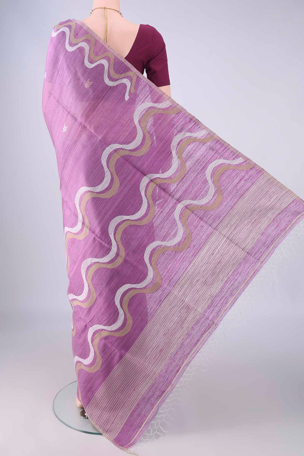 Flat view of Lavender Jute Silk Saree with Plain Body and Thread Border. 