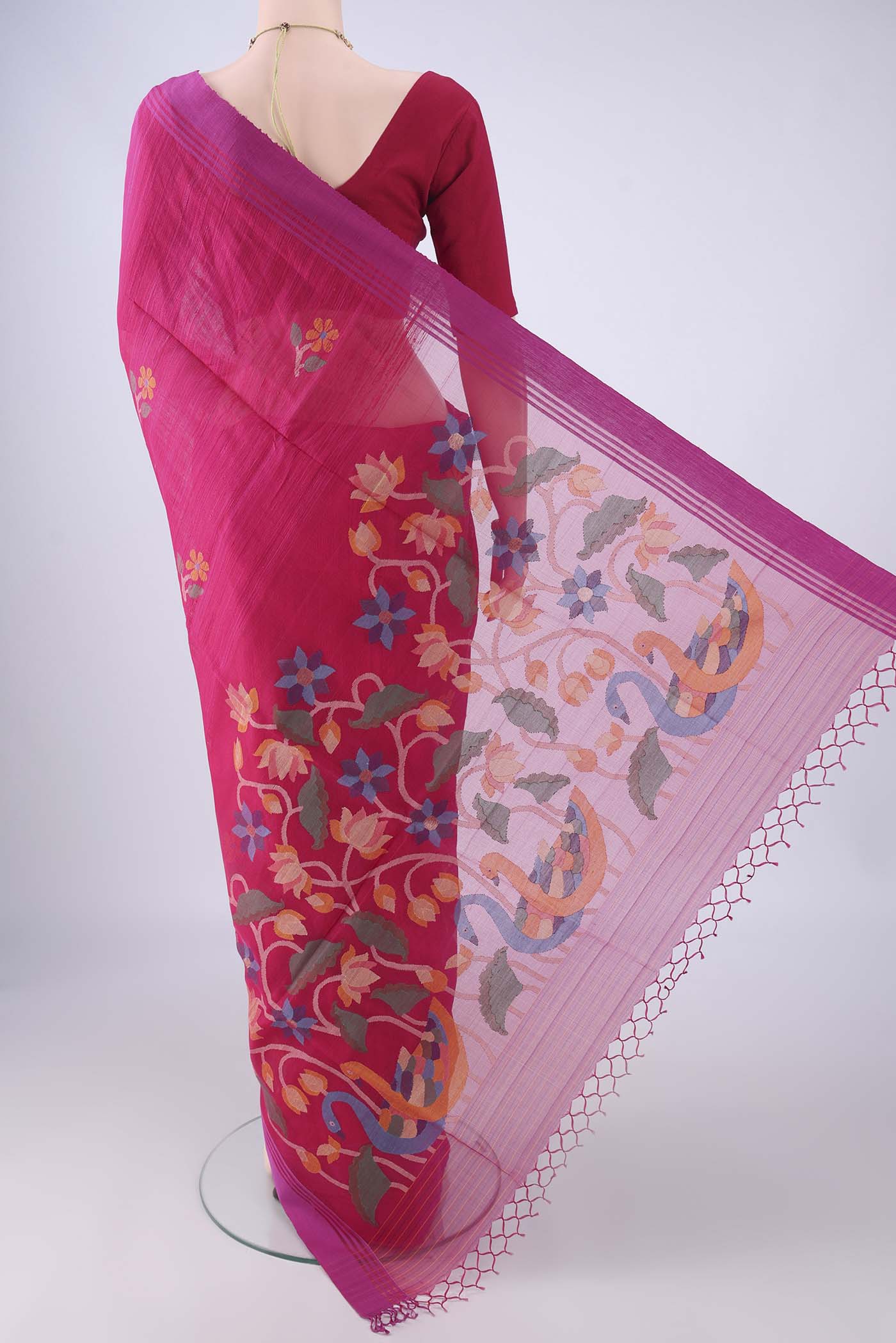 Flat view of Rani Pink Jute Silk Saree with Thread Butta on the body and Plain Border. 