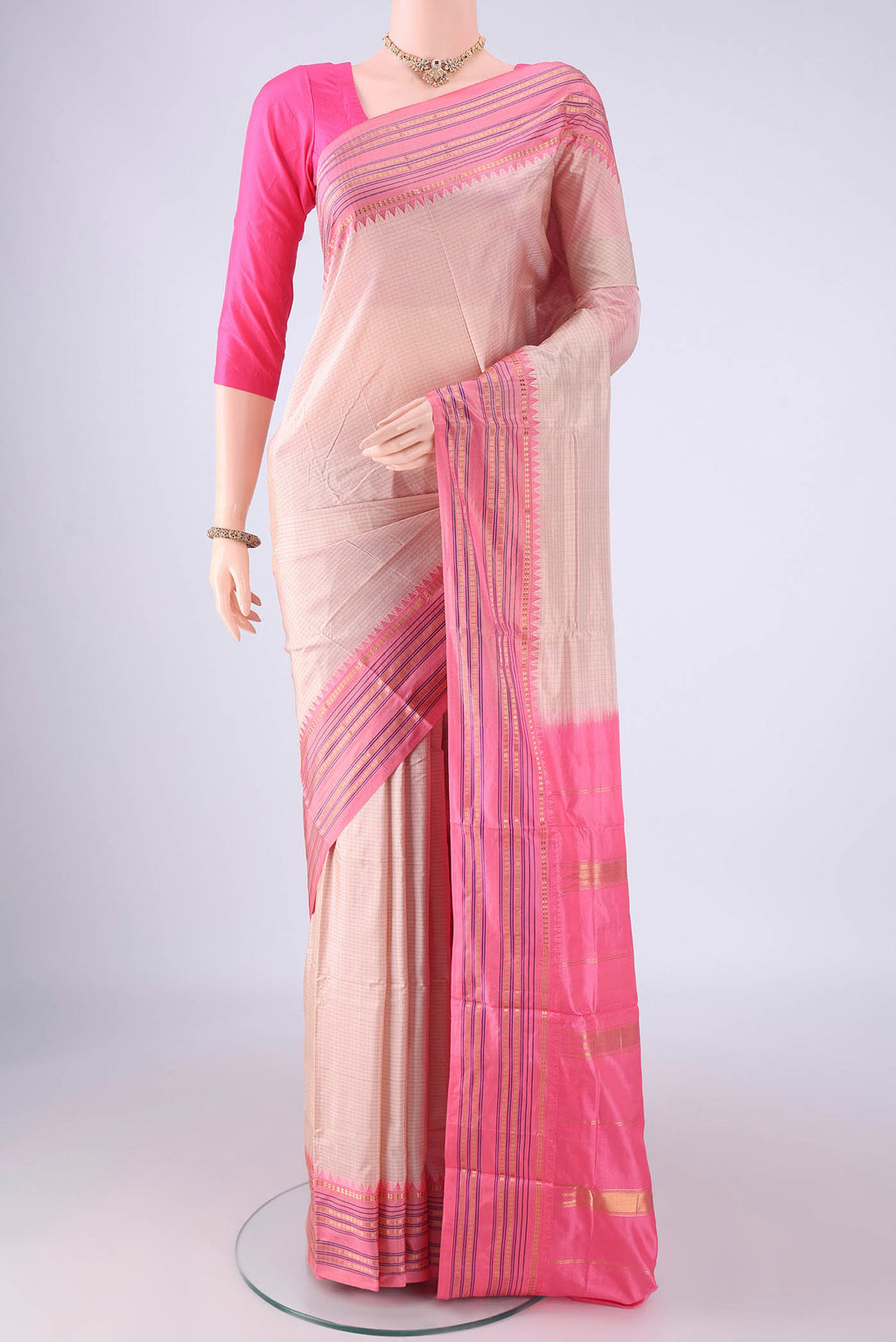 Beige Narayanpet Silk Saree with Checked design on the body and Zari Border.  displayed on a mannequin