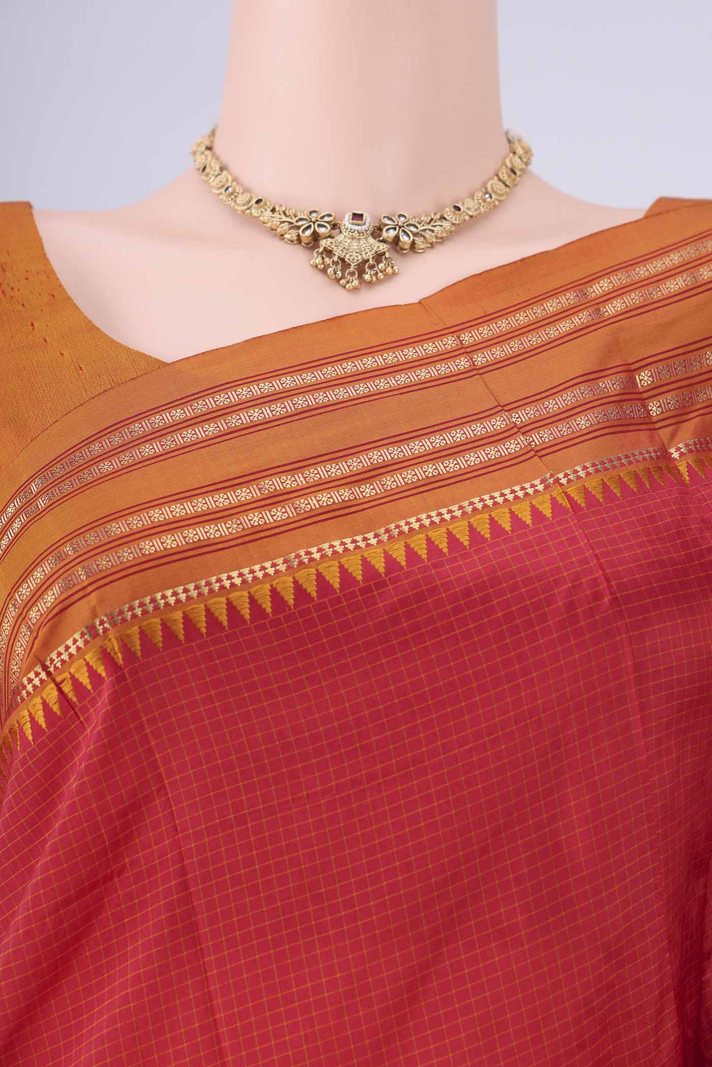 Border image of Red Narayanpet Silk Saree with Checked design on the body and Temple Border. 