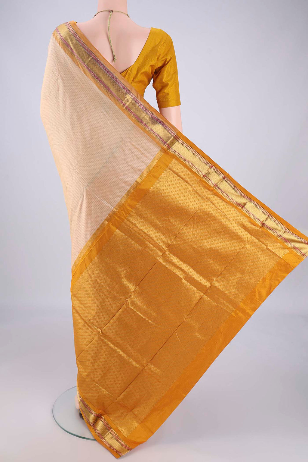 Flat view of Cream Narayanpet Silk Saree with Checked design on the body and Zari Border. 